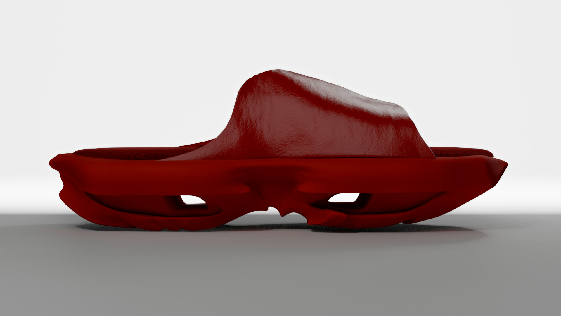 Red geta in silhouette against a white wall